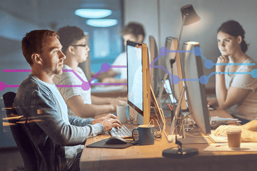 The most dedicated team of developers around Shot of a group of young people using computers during a late night in a modern office